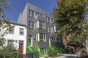 Washington apartment for rent - the exterior of a building with green stairs