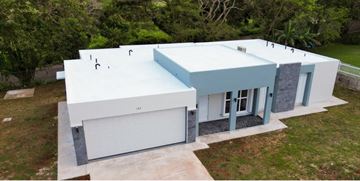 Talofofo house for rent - an aerial view of a white and blue house