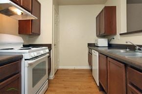 Buda townhouse for rent - a kitchen with a stove and a sink