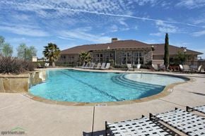 Buda townhouse for rent - a swimming pool with a large building in the background