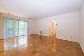 Timonium apartment for rent - A room with wooden flooring and a window with blinds.