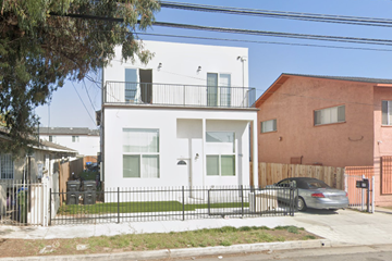 Los Angeles apartment for rent - a white house with a car parked in front of it