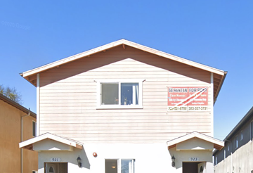 Los Angeles apartment for rent - a white house with a sign on the side of it