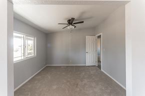 Anza house for rent - an empty living room with a ceiling fan