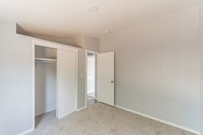 Anza house for rent - an empty bedroom with a closet and a door to a hallway