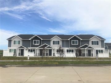 Ankeny apartment for rent - a large house with a blue sky in the background