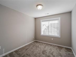West Des Moines apartment for rent - A room with a carpeted floor and a window with blinds.