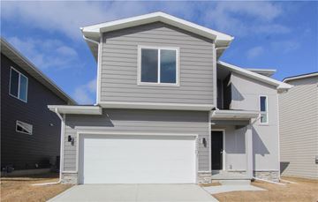 Urbandale apartment for rent - a gray house with a white garage door