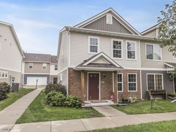 West Des Moines apartment for rent - A two-story house with a red door and a garage.