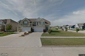 Waukee apartment for rent - A row of houses with a clear sky above them.