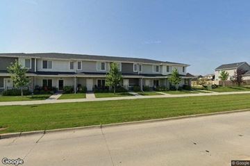 Waukee apartment for rent - a row of houses on the side of a street