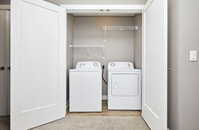 Waukee apartment for rent - A laundry room with a washer and dryer.
