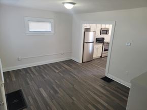 Lima apartment for rent - A kitchen with a refrigerator, microwave, and oven.