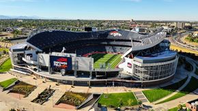 Denver apartment for rent - A large stadium with a banner that reads "EMPOWER FIELD".