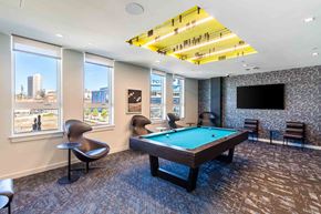 Worcester apartment for rent - A room with a pool table and a chair.