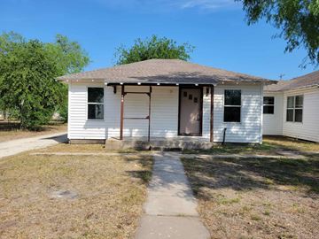 Mathis house for rent - a small white house with a sidewalk in front of it