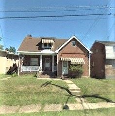 West Mifflin apartment for rent - A house with a brown roof and a white awning.