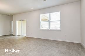 Kissimmee house for rent - the living room of a new home with white walls and a window