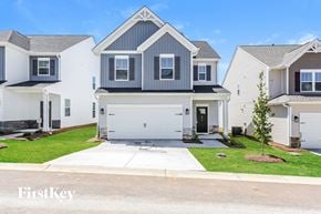 Simpsonville house for rent - A house with a garage is shown in the image.