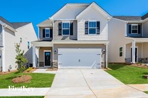 Simpsonville house for rent - A house with a garage and a driveway in front.
