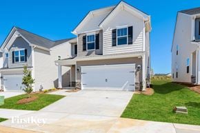 Simpsonville house for rent - A white house with a garage is shown in the image.