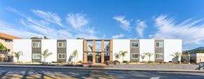Spring Valley apartment for rent - a large white building with a street in front of it