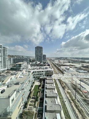 Vancouver apartment for rent - A cityscape with a mix of residential and commercial buildings.