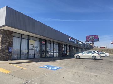 Kearney apartment for rent - A car is parked in a handicapped parking spot outside a Dairy Queen.