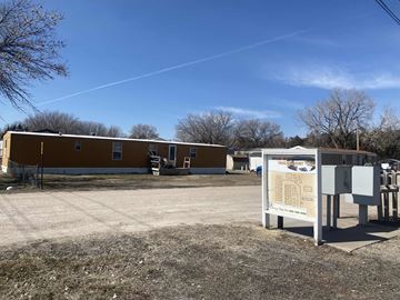 Kearney apartment for rent - a building with a sign in front of it