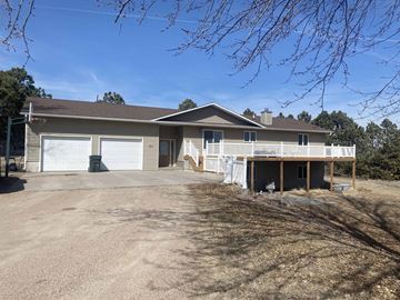 Kearney apartment for rent - a large house with a driveway and a garage door