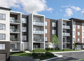 Bedford apartment for rent - A modern apartment building with balconies and a garage door.