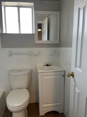 Austin apartment for rent - A white toilet and sink in a bathroom.