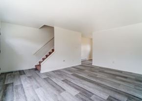 Lima apartment for rent - A room with a staircase and wooden flooring.
