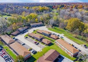 Lima apartment for rent - an aerial view of a group of buildings and a parking lot