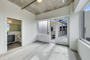 Chicago apartment for rent - A room with a white door and a window.