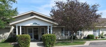 Howard Lake apartment for rent - a white house with a tree in front of it