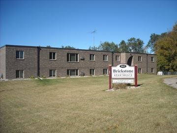 Avon apartment for rent - A large building with a sign that says Brickstone Apartments in front of it.