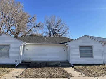 Elm Creek apartment for rent - the front of a white house with a gray roof