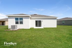 Bartow house for rent - a home with a grass yard and a house