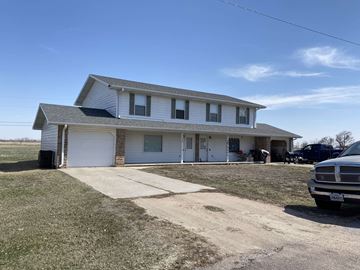 Overton apartment for rent - a white house with a driveway and a car in front of it