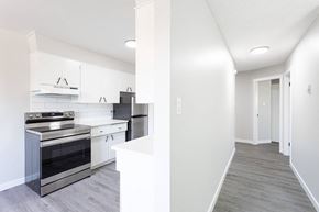 Leduc apartment for rent - a renovated kitchen with white cabinets and black appliances