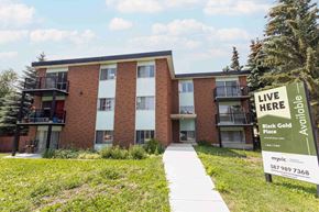 Leduc apartment for rent - a building with a live here sign in front of it