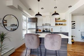 Edmonton apartment for rent - Two chairs are placed in front of a kitchen island.