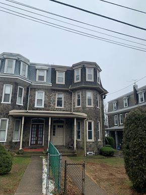 Philadelphia apartment for rent - the front of an old house with a blue roof
