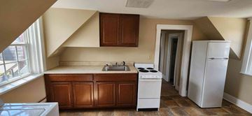 Clinton apartment for rent - a small kitchen with a sink and a refrigerator