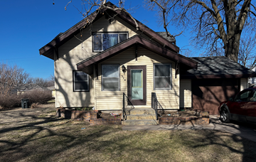 Shelton apartment for rent - a yellow house with a brown roof and a porch