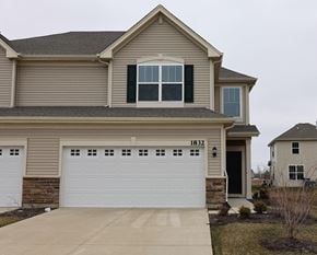 Crown Point house for rent - A two-story house with a garage and a driveway.