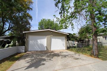 Escondido apartment for rent - a small garage with a white door and a tree