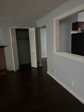 Cincinnati house for rent - a living room with a window and a door to a closet
