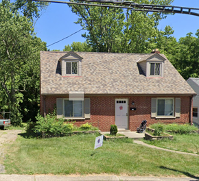 Cincinnati house for rent - a small brick house with a lawn in front of it
